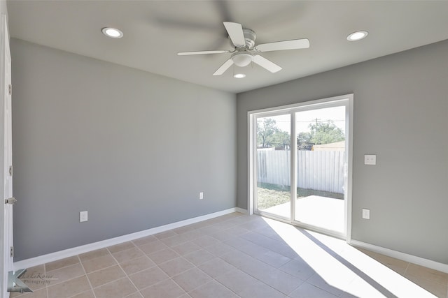 tiled empty room with ceiling fan