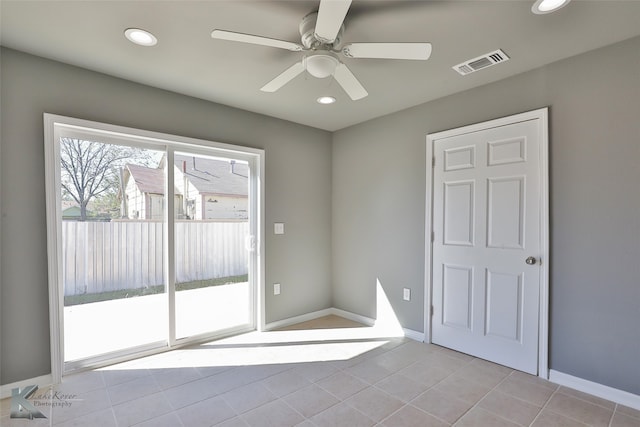 interior space featuring ceiling fan and light tile patterned flooring