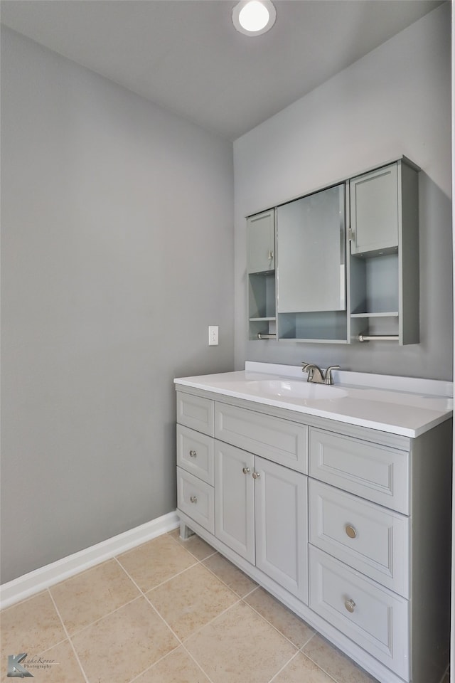 bathroom featuring tile patterned flooring and vanity