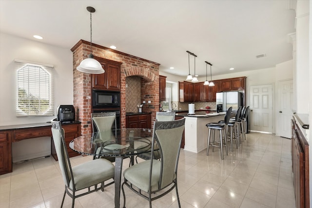 tiled dining room with sink