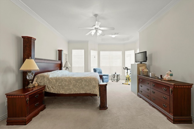 bedroom with ornamental molding, ceiling fan, and light colored carpet