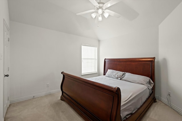 carpeted bedroom featuring ceiling fan and lofted ceiling