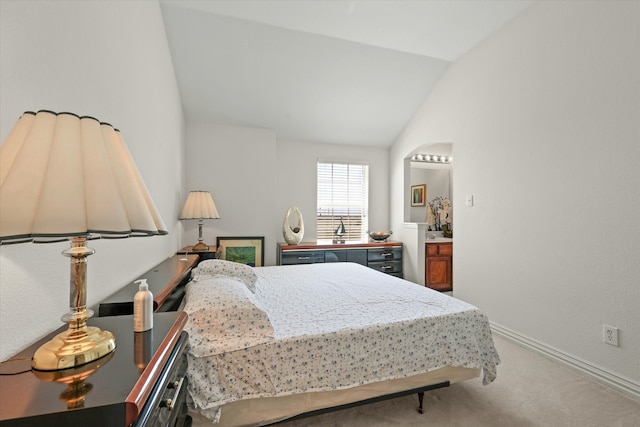 carpeted bedroom featuring lofted ceiling