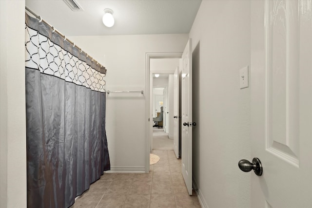 bathroom with tile patterned floors