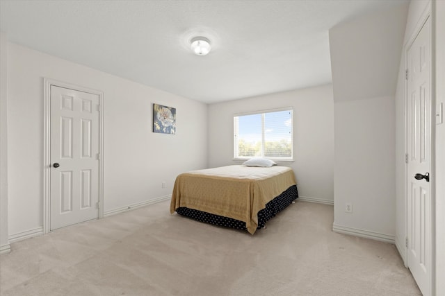 bedroom with light carpet