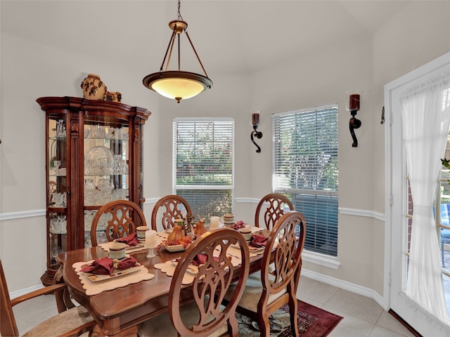 dining space featuring light tile patterned floors