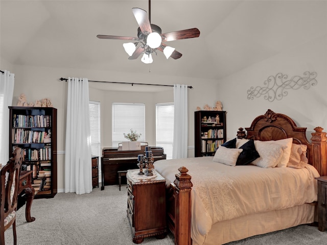 carpeted bedroom with lofted ceiling and ceiling fan