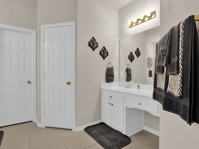 bathroom featuring tile patterned flooring and vanity