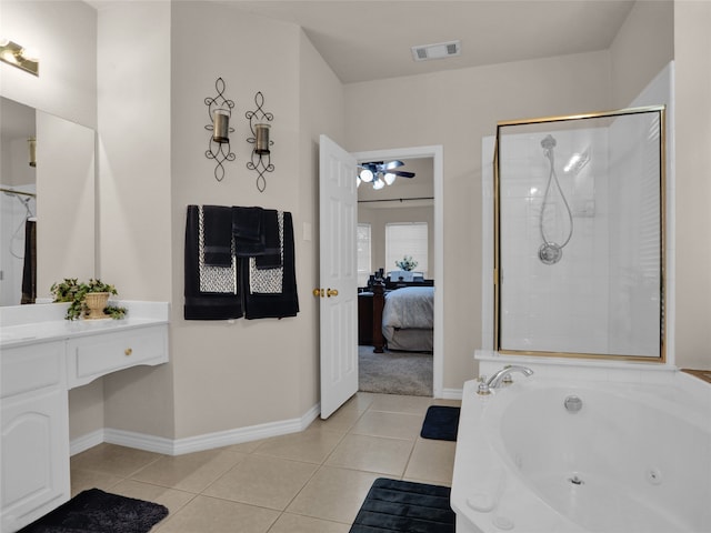 bathroom with plus walk in shower, tile patterned flooring, ceiling fan, and vanity