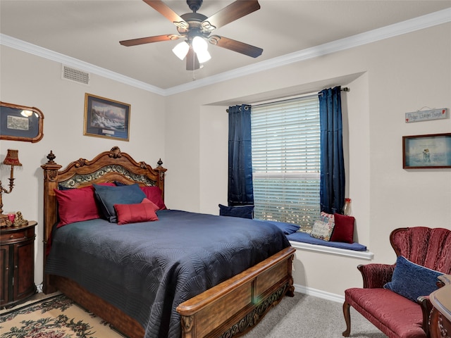 carpeted bedroom with crown molding and ceiling fan