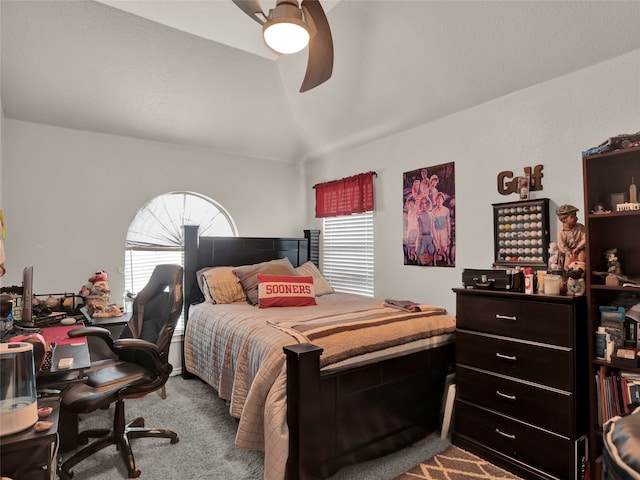 carpeted bedroom with vaulted ceiling, multiple windows, and ceiling fan