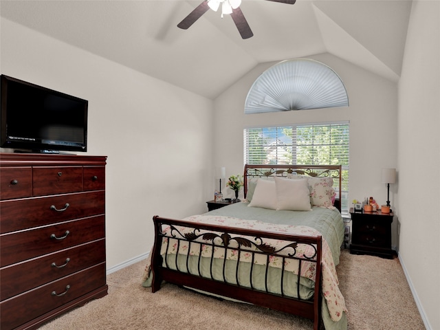 bedroom with ceiling fan, light colored carpet, and lofted ceiling