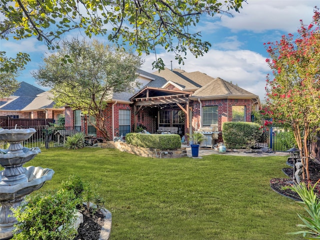 rear view of property with a pergola, a patio area, and a lawn