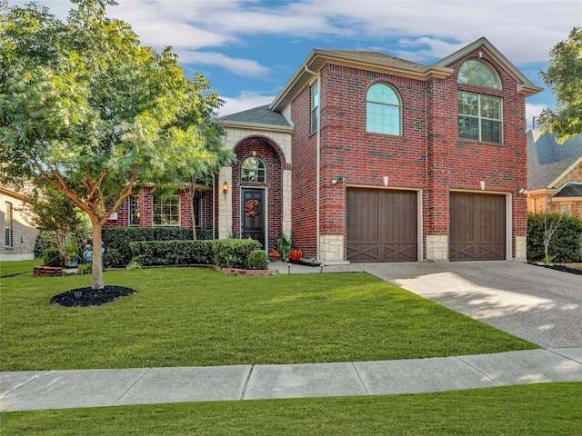 view of front of property with a garage and a front lawn