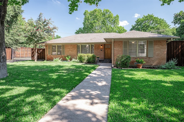 ranch-style house featuring a front lawn