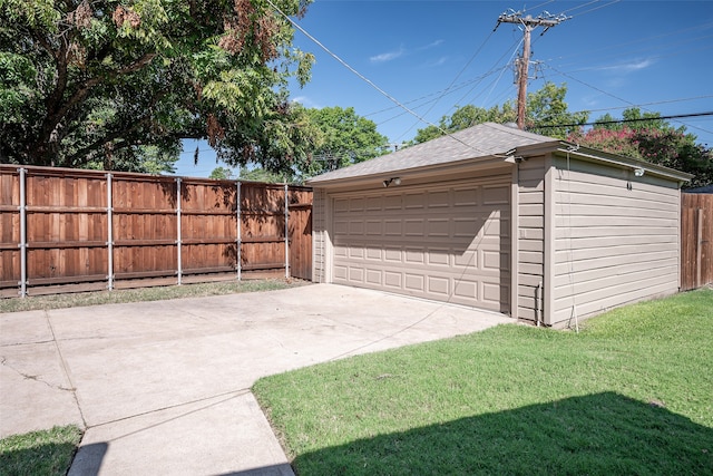 garage featuring a yard