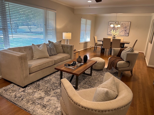 living room with hardwood / wood-style flooring and ornamental molding