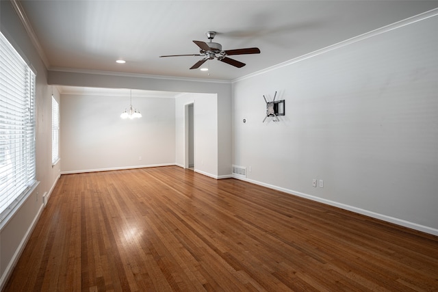 unfurnished room featuring dark hardwood / wood-style flooring, ceiling fan with notable chandelier, and crown molding