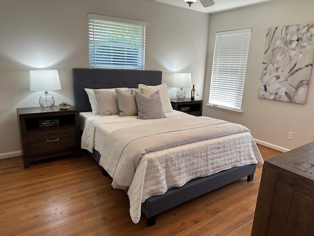 bedroom with hardwood / wood-style flooring and ceiling fan