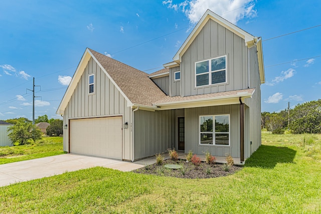 view of front of home featuring a front lawn and a garage