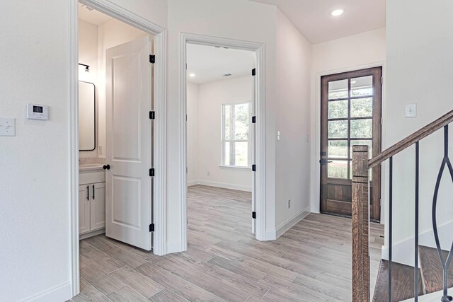 entryway featuring a wealth of natural light and light wood-type flooring