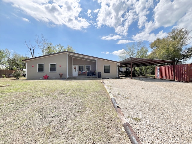 view of front of house featuring a front yard and a carport