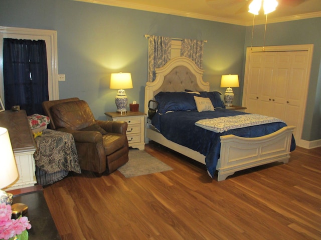 401 Craig St, Hillsboro, TX 76645 - bedroom featuring baseboards, a ceiling fan, wood finished floors, a closet, and crown molding