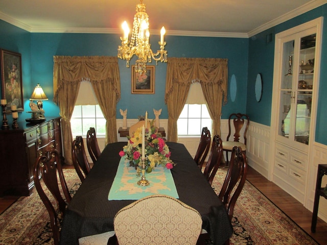 401 Craig St, Hillsboro, TX 76645 - dining room featuring a wealth of natural light, wood finished floors, an inviting chandelier, and ornamental molding