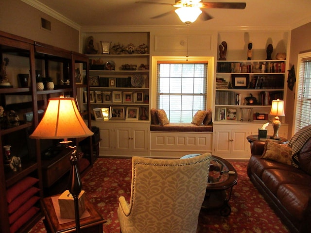 401 Craig St, Hillsboro, TX 76645 - living area with a healthy amount of sunlight, built in features, ceiling fan, crown molding, and carpet floors