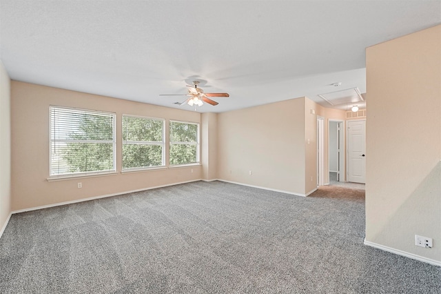 spare room with ceiling fan and carpet flooring