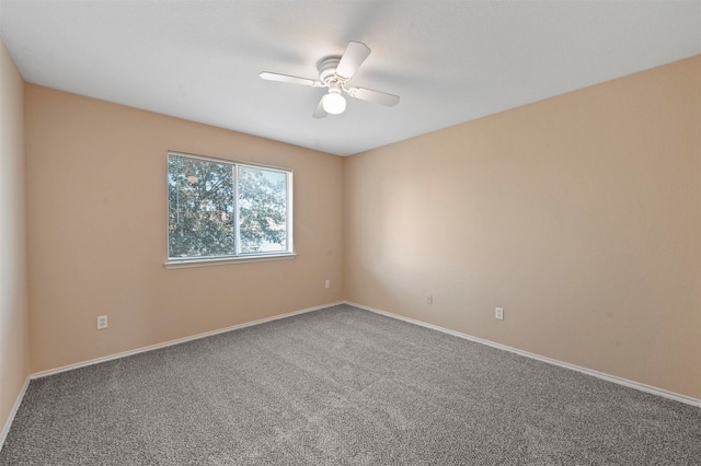 empty room featuring carpet and ceiling fan