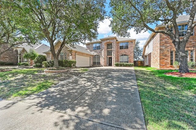 view of front facade featuring a garage and a front lawn