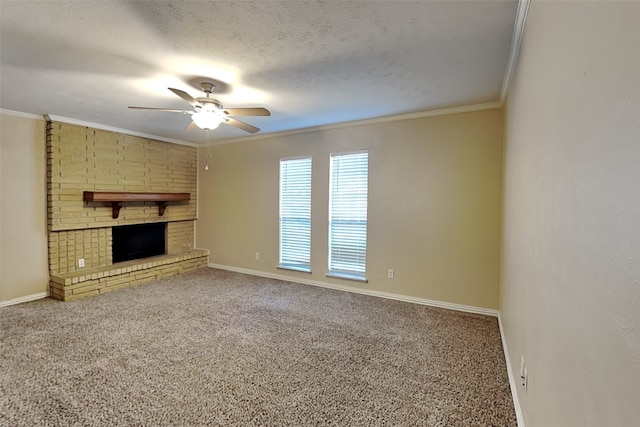 unfurnished living room with ceiling fan, a fireplace, ornamental molding, and carpet