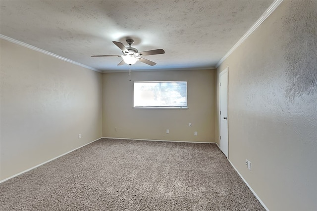 spare room with ceiling fan, a textured ceiling, ornamental molding, and carpet