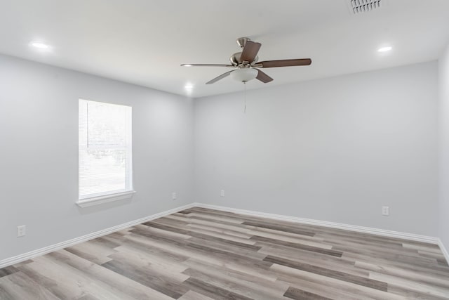 empty room featuring light wood-type flooring and ceiling fan