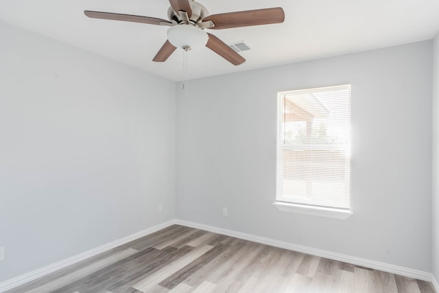 unfurnished room featuring light hardwood / wood-style floors and ceiling fan