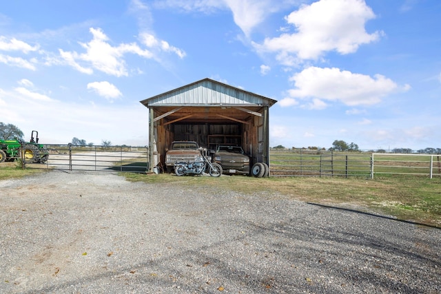 view of outbuilding with a rural view