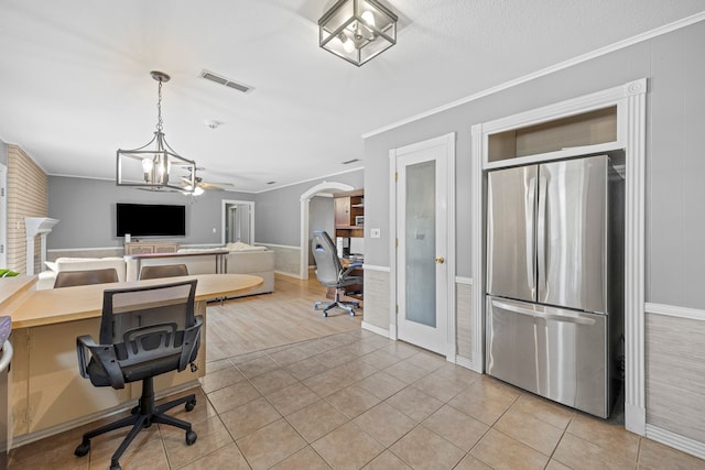 office with ceiling fan with notable chandelier, ornamental molding, and light tile patterned floors