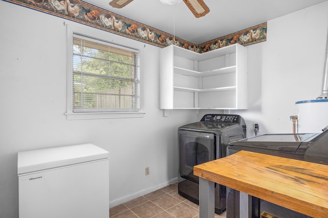 washroom with washing machine and clothes dryer, ceiling fan, and light tile patterned flooring