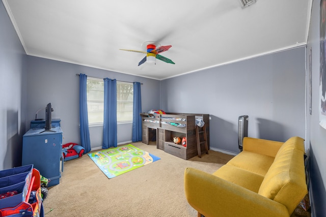 game room featuring ornamental molding, ceiling fan, and light colored carpet