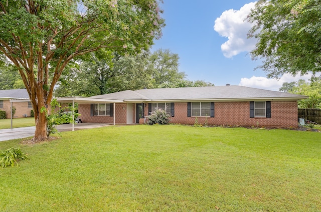 single story home with a front yard and a carport