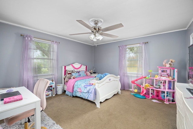 carpeted bedroom with ornamental molding and ceiling fan