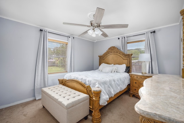 bedroom featuring ceiling fan, light colored carpet, and ornamental molding