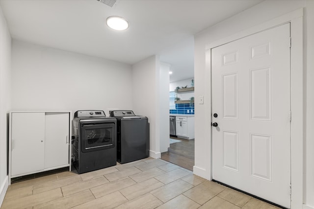 laundry area with washer and dryer