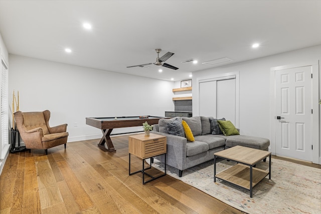 living room with light hardwood / wood-style flooring, pool table, and ceiling fan