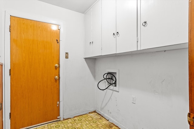 laundry room featuring washer hookup and cabinets