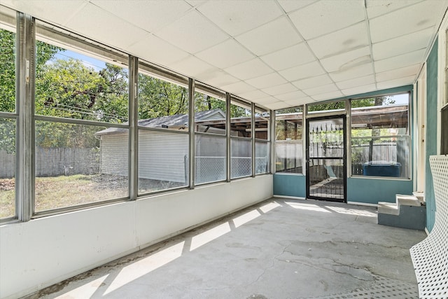 unfurnished sunroom featuring a paneled ceiling