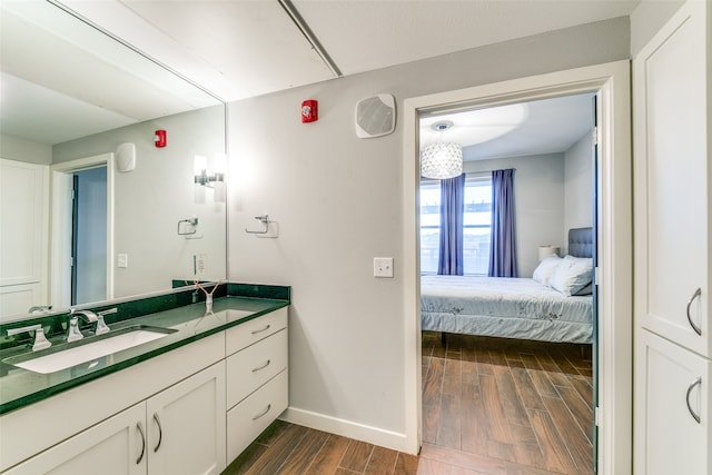 bathroom with wood-type flooring and vanity