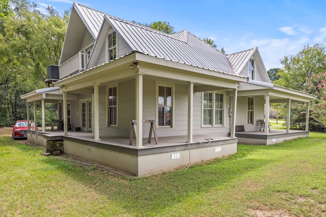 exterior space featuring a porch and a yard