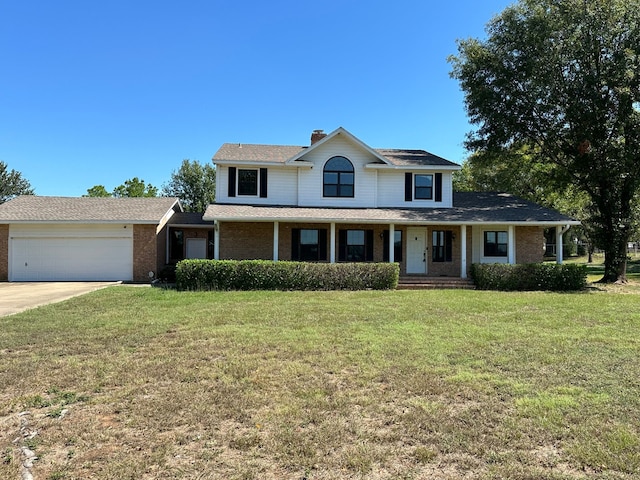 view of front property with a front lawn and a garage